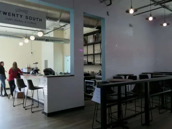 Attractive public market with sunny outdoor space and cute balcony upstairs.