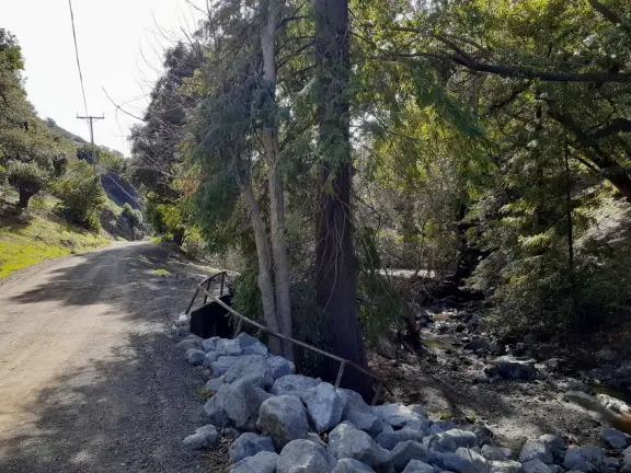Wonderful wide open spaces with mountains of all shapes and sizes! First mile is shady. Four mile out and back, or five mile lollipop loop hike. Optional detours: architecture creations, or mountaintop swing.