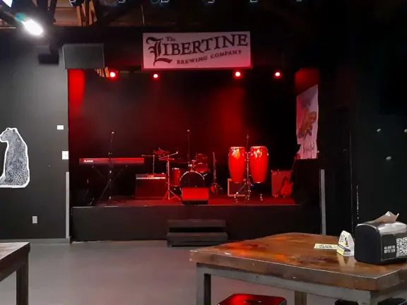 A main street of late 19th century storefronts, popular cafes, and a hip college scene. Recently, suffering an epidemic of homelessness relating to mental health problems.