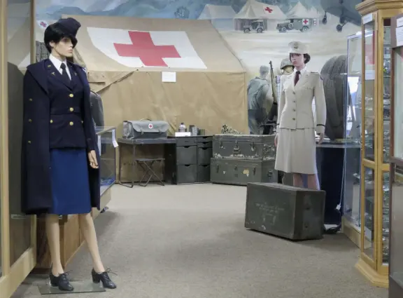 Military museum with jet fighters, World War I and II exhibits, historic and racing cars in Woodland Auto Display, bombs and missiles, communications equipment, and jeeps.