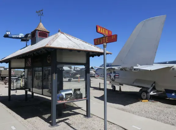 Military museum with jet fighters, World War I and II exhibits, historic and racing cars in Woodland Auto Display, bombs and missiles, communications equipment, and jeeps.