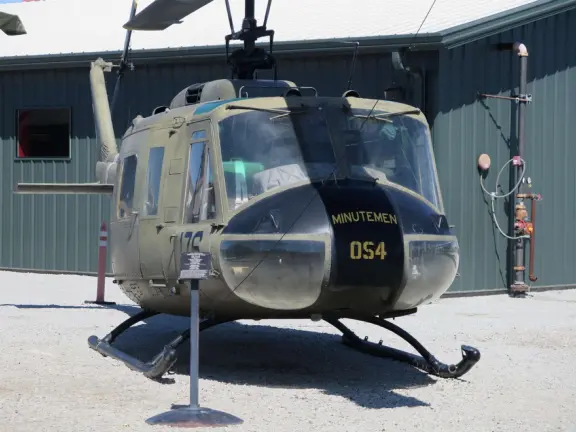 Military museum with jet fighters, World War I and II exhibits, historic and racing cars in Woodland Auto Display, bombs and missiles, communications equipment, and jeeps.