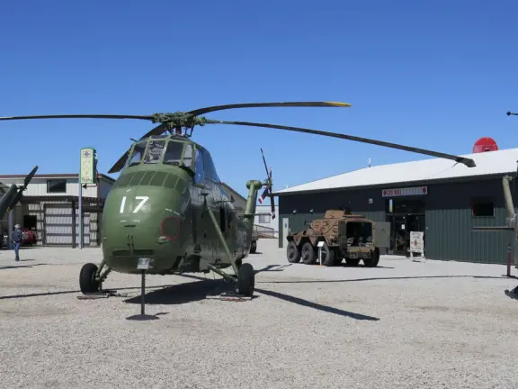 Military museum with jet fighters, World War I and II exhibits, historic and racing cars in Woodland Auto Display, bombs and missiles, communications equipment, and jeeps.
