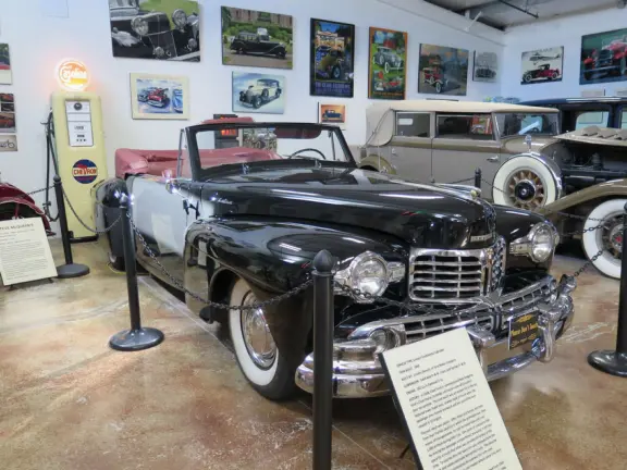 Military museum with jet fighters, World War I and II exhibits, historic and racing cars in Woodland Auto Display, bombs and missiles, communications equipment, and jeeps.