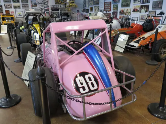 Military museum with jet fighters, World War I and II exhibits, historic and racing cars in Woodland Auto Display, bombs and missiles, communications equipment, and jeeps.