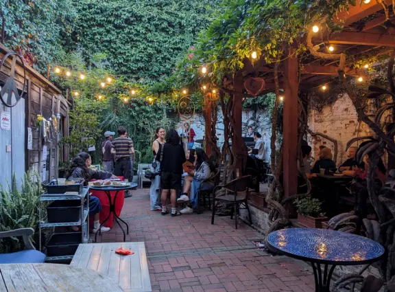 A main street of late 19th century storefronts, popular cafes, and a hip college scene. Recently, suffering an epidemic of homelessness relating to mental health problems.