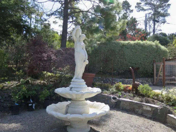 Garden in a sunny, sheltered spot, with cottage with turret under redwood trees, Buddhist gazebo, goats, and flowers galore! Seasonal pumpkins and Christmas market!