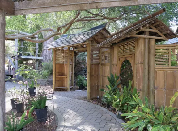 Garden in a sunny, sheltered spot, with cottage with turret under redwood trees, Buddhist gazebo, goats, and flowers galore! Seasonal pumpkins and Christmas market!