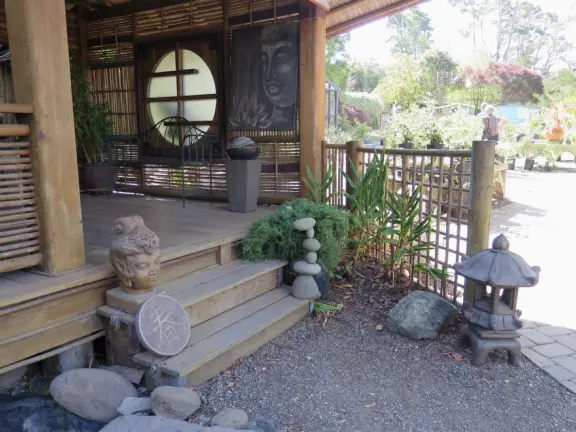 Garden in a sunny, sheltered spot, with cottage with turret under redwood trees, Buddhist gazebo, goats, and flowers galore! Seasonal pumpkins and Christmas market!