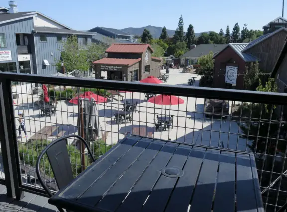 Attractive public market with sunny outdoor space and cute balcony upstairs.