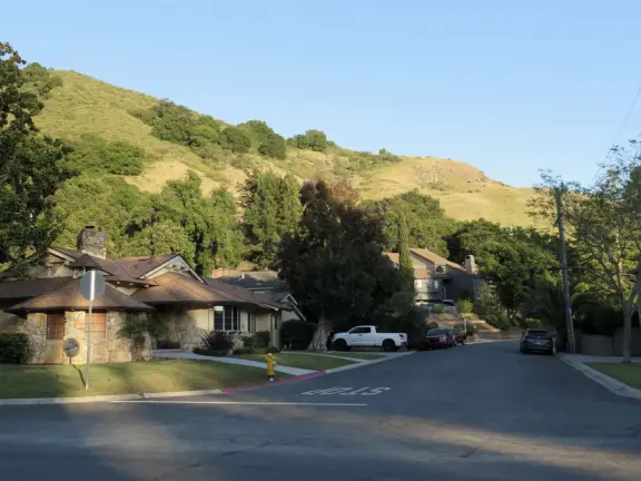 Pretty neighborhood with sweet houses and gardens, and bridge over the creek.