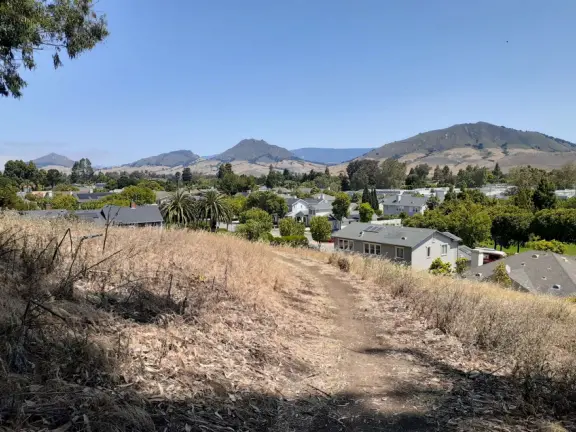 Hike with views of Cerro San Luis and Bishop Peak mountains and town, and then a tranquil valley on the other side.