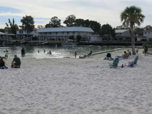 White sand beach on the canals of Crystal River, with a roped swimming section that is wonderful for a dip!