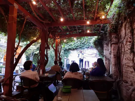 A main street of late 19th century storefronts, popular cafes, and a hip college scene. Recently, suffering an epidemic of homelessness relating to mental health problems.