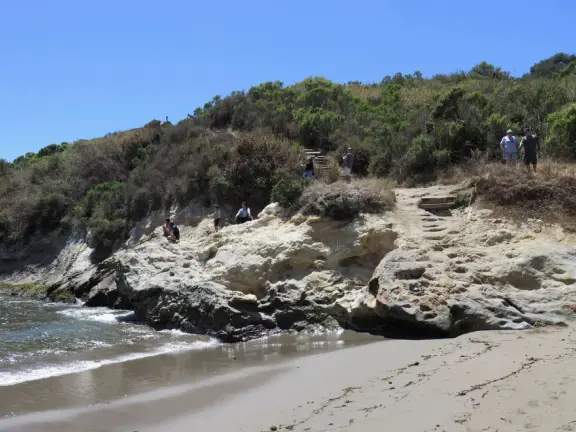 Warm, sheltered cove below Smuggler's Cave. Steep climb down.