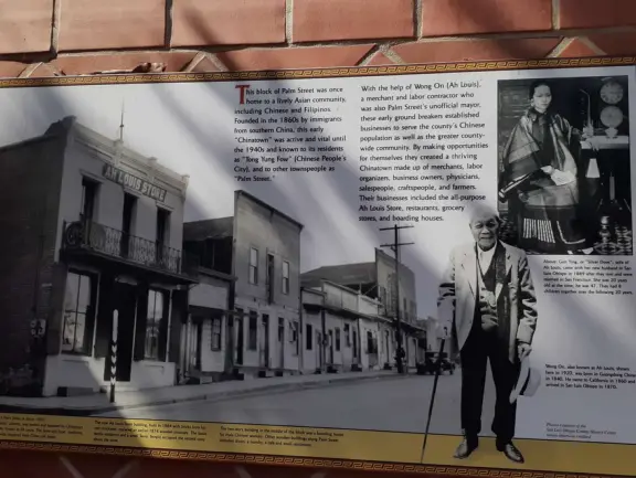 Spanish mission from late 18th century, in downtown San Luis Obispo, with giant roses in the garden behind and a lively plaza in front.