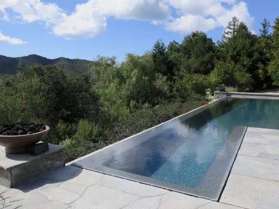 Wide partially shady path that leads through oak forest, past a market, and a Secret Garden with live music, to Avila Beach.