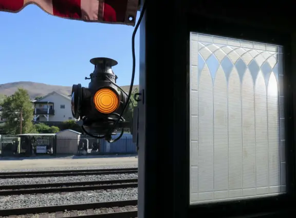 Cute light and awning on the historic train carriage. 