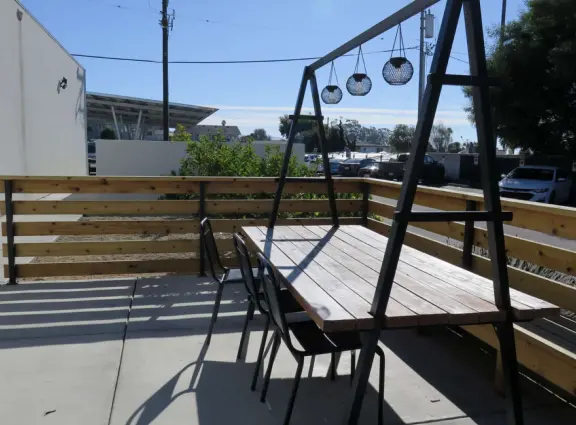 A lovely, hilly street with ocean views, lined with cute cafes.