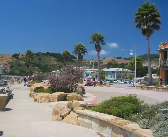 Colorful, pretty main street and boardwalk, with great cafes, lovely ship playground, and mesmerizing yellow cliffs.