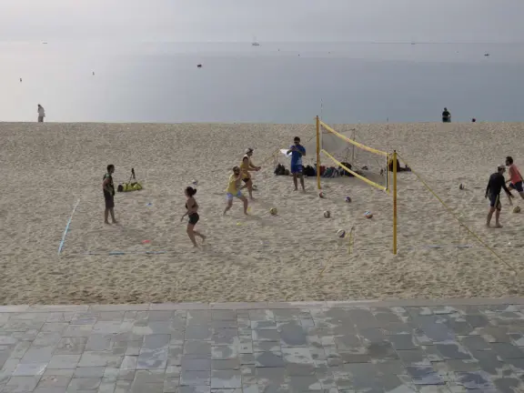 A flat, straight beach with a wide boardwalk where fitness reigns supreme! It reminded me of Venice Beach in California.