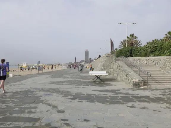 A flat, straight beach with a wide boardwalk where fitness reigns supreme! It reminded me of Venice Beach in California.