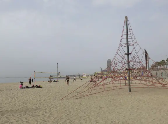 A flat, straight beach with a wide boardwalk where fitness reigns supreme! It reminded me of Venice Beach in California.