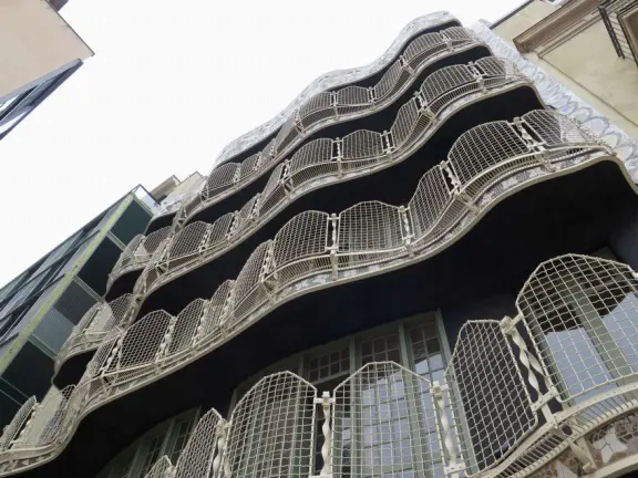 Extremely crowded tour of mansion renovated by Gaudi, on the elegant Passeig de Gracia street.