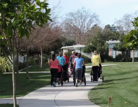Playground with moving statue in a cookie-cutter development.