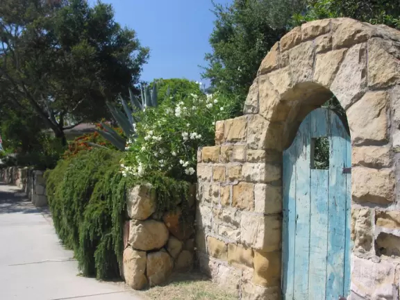 A walk past landscaped gardens and rows of weeping willows.