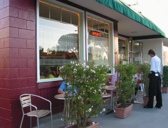 Italian restaurant with delicious gelato, independent bookstore, and excellent French bakery, plus castle tower and view of the mountains.