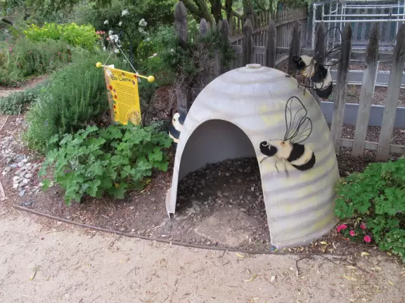 Botanical garden on top of a hill with views all around, cactus garden, colorful wildflowers, and imaginative kid's garden.