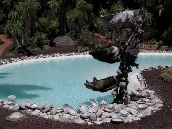 An estate with paths winding around 25 acres of varied, exquisite gardens.
