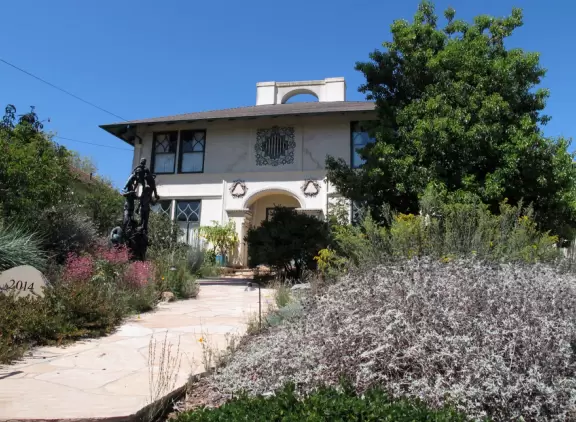A walk past landscaped gardens and rows of weeping willows.