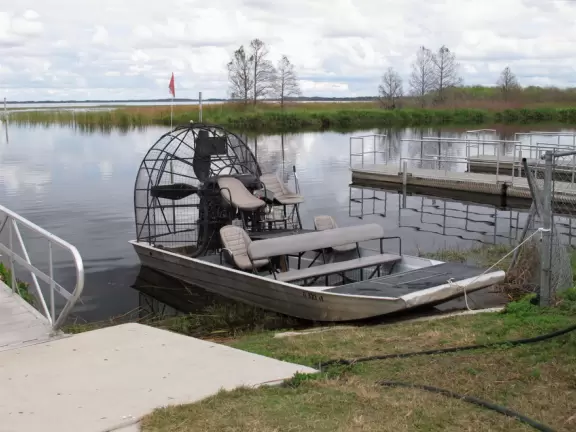 Glide over the water that mirrors the arcing sky, and see alligators!