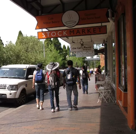 Delightful town with French cafes and bakeries, and residential streets overflowing with flowers and greenery.