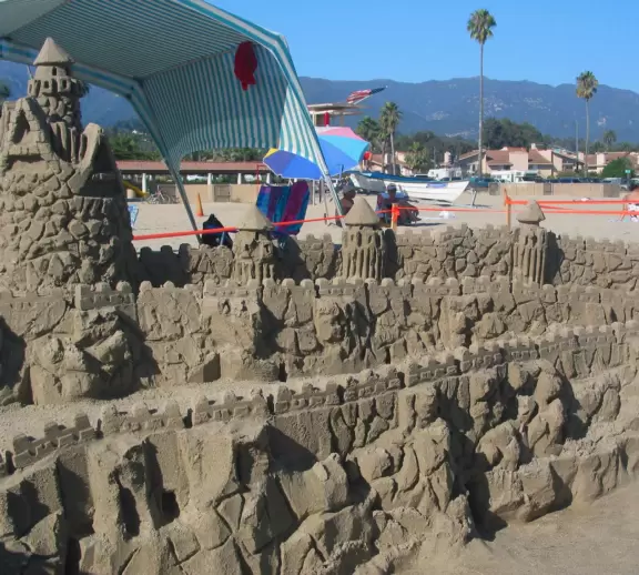 A wide sandy beach that's fun for kids! Wonderful for a long walk around the red cliffs.