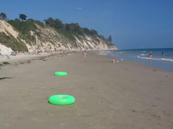 A popular beach with families and dog owners. Come for a long walk under beautiful cliffs.