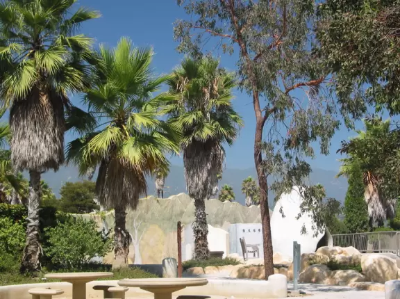 A remarkably pretty planned park with a stream that runs through it, lots of plants, an imaginative Spanish playground, and whale statues that spout water!