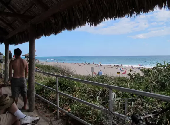 Beach with cute pier and aquamarine water.