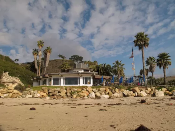 A popular beach with families and dog owners. Come for a long walk under beautiful cliffs.