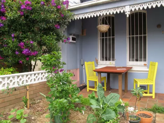 Little shops and cafes in streets lined with Victorian townhouses.