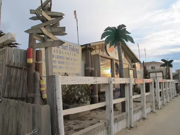 Rugged sand-swept place with high dunes, popular with off-road vehicle enthusiasts.