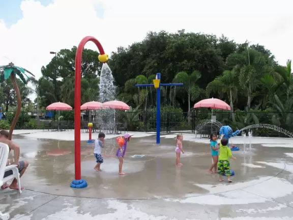 Fun splash playground and splash pad with plenty of shaded chairs for parents.