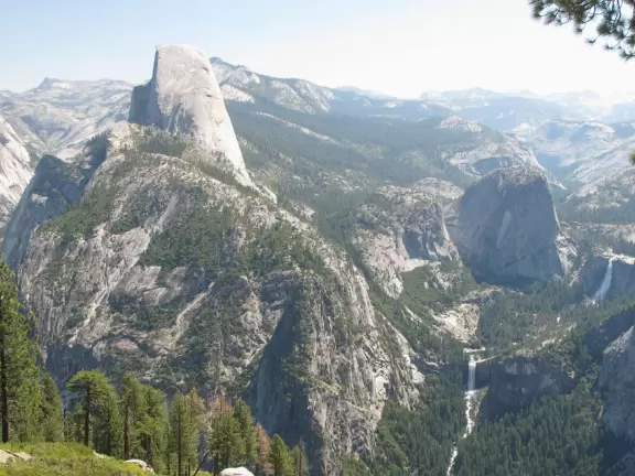 Breathtaking side-on view of half dome, three waterfalls, and the entire stunning valley.