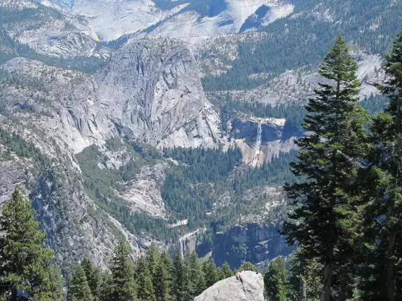 Breathtaking side-on view of half dome, three waterfalls, and the entire stunning valley.