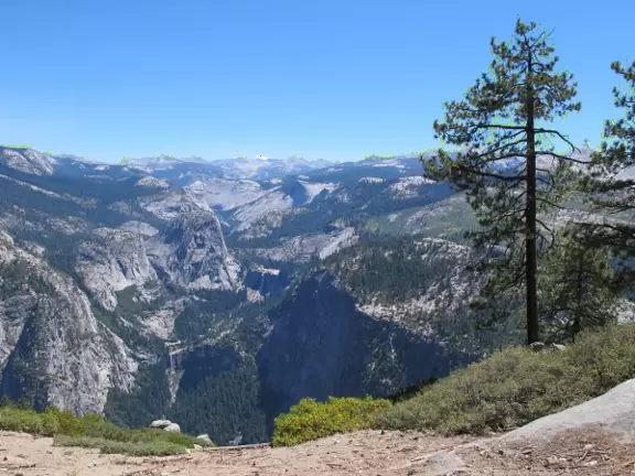 Breathtaking side-on view of half dome, three waterfalls, and the entire stunning valley.