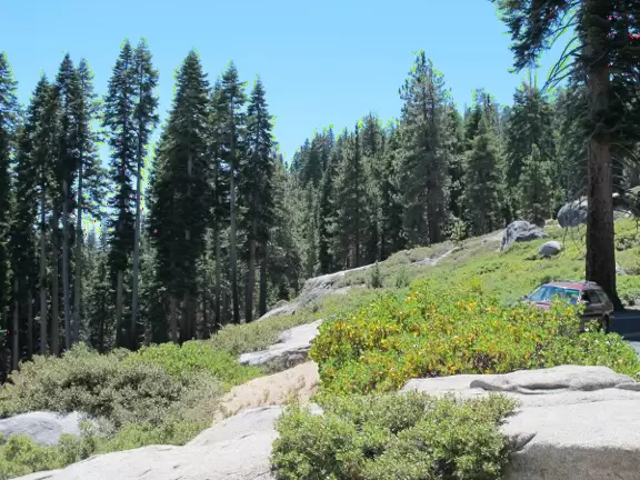 Breathtaking side-on view of half dome, three waterfalls, and the entire stunning valley.