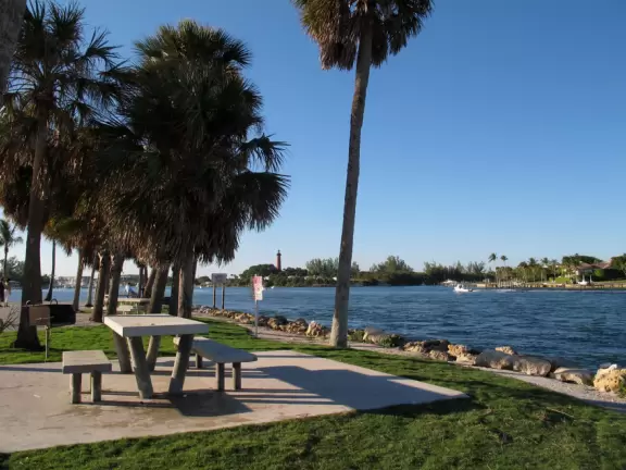 Large lagoon with clear water where kids can swim, tons of shade, and playground in the sand.