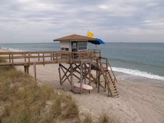 Long, narrow beach with a seawall backed by fancy hotels, a happening feel, and an oceanfront cafe.